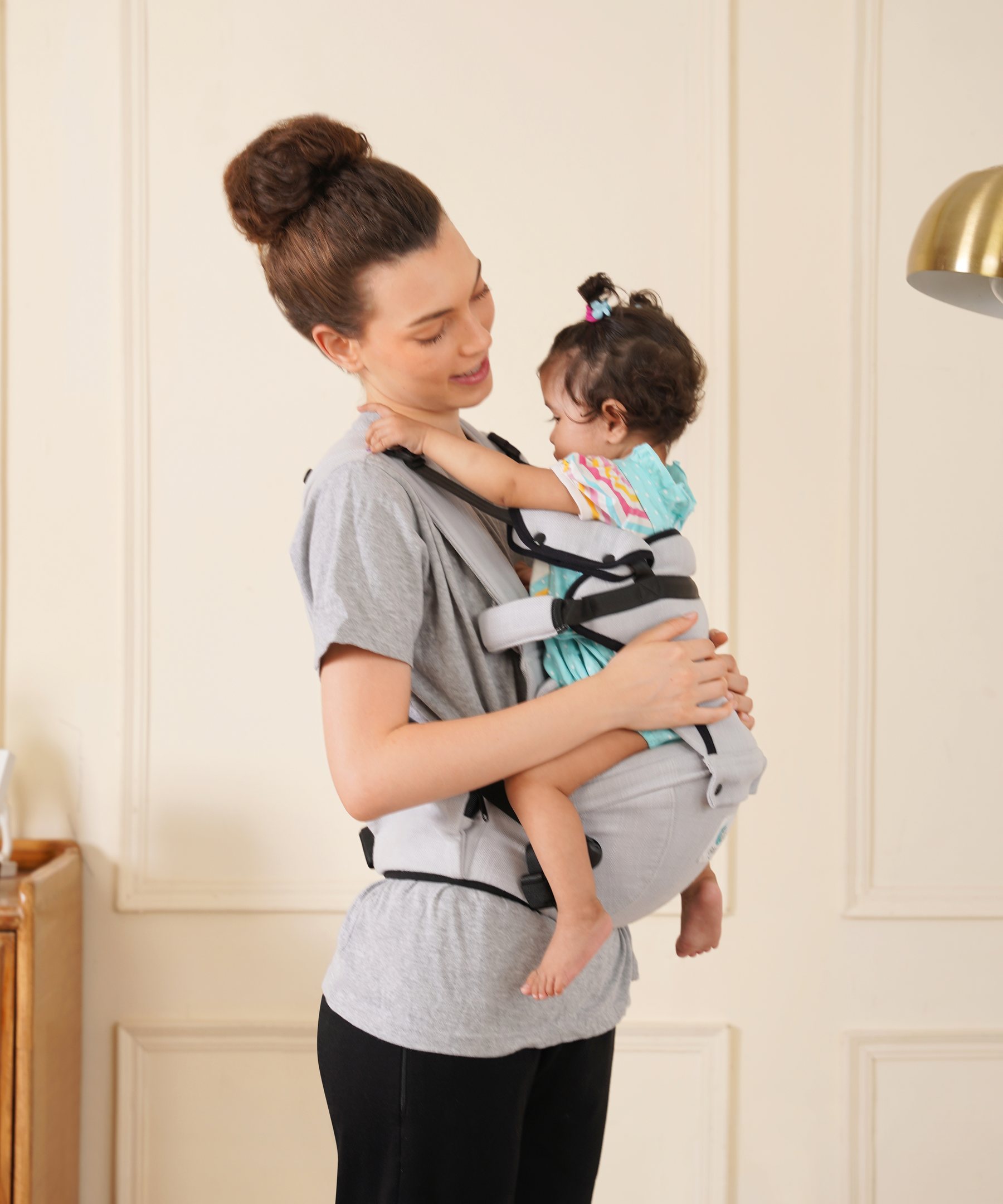 Parent wearing Bibzy upright indoors